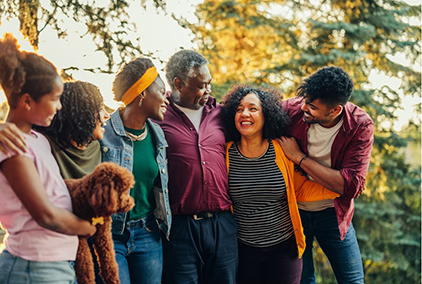 Family Group Hug In The Woods