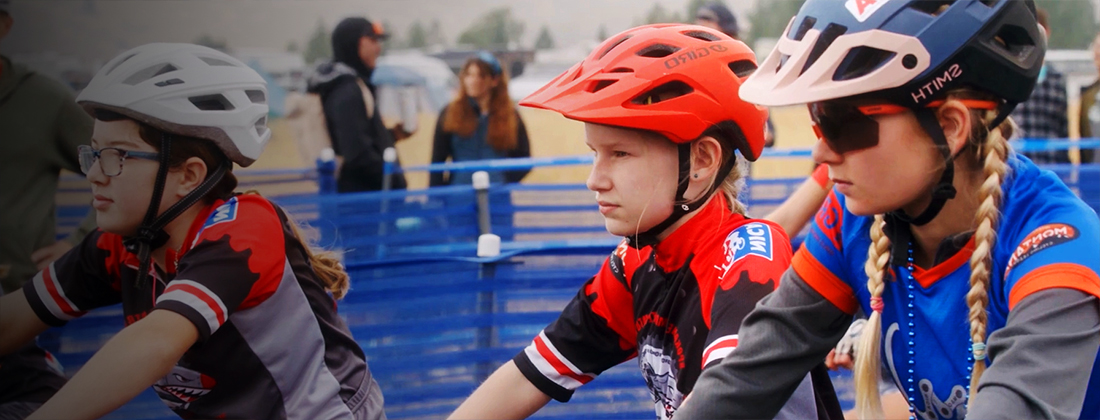 Three youth girls participating in a bike race